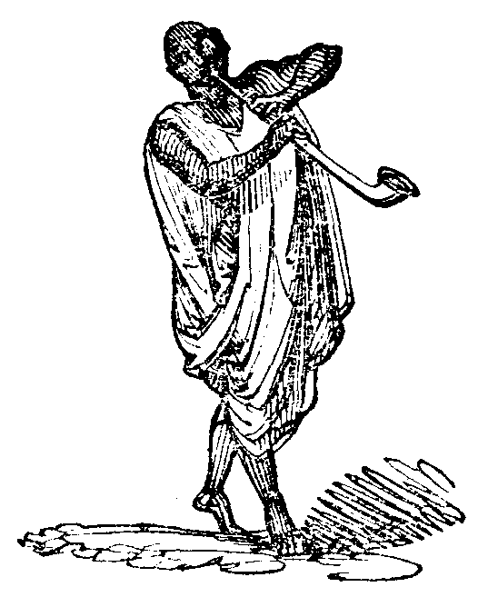 Musician blowing a long pipe