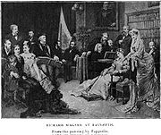 Une impression montrant seize personnes dans une grande salle avec des peintures et une grande bibliothèque contre le mur. Un homme avec de longs cheveux blancs joue un piano à queue que plusieurs autres regardent. Wagner, coiffé d'une casquette et se appuyant sur le bras d'un fauteuil, suit la musique dans une partition.