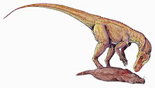 Dinosaure bipède se penchant pour nourrir sur une petite morts reptile, ressemblait à un mammifère